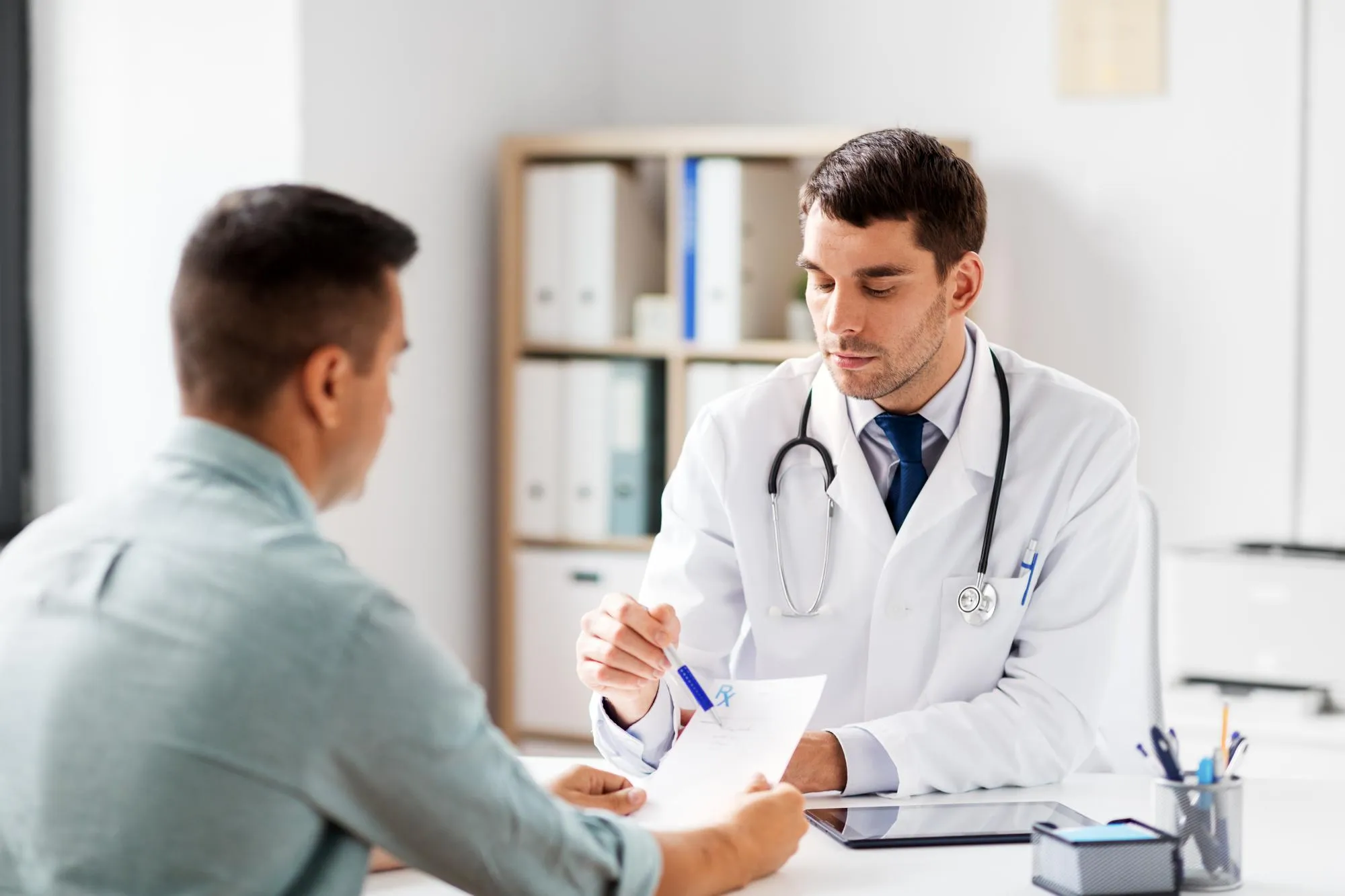 Doctor discussing prior authorization services with a patient.