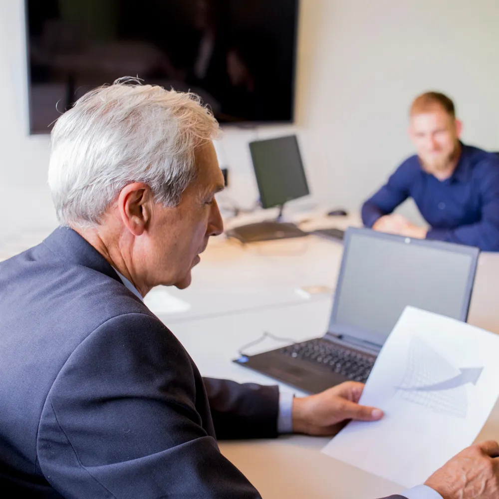 Healthcare provider reviewing prior authorization requests with a patient.