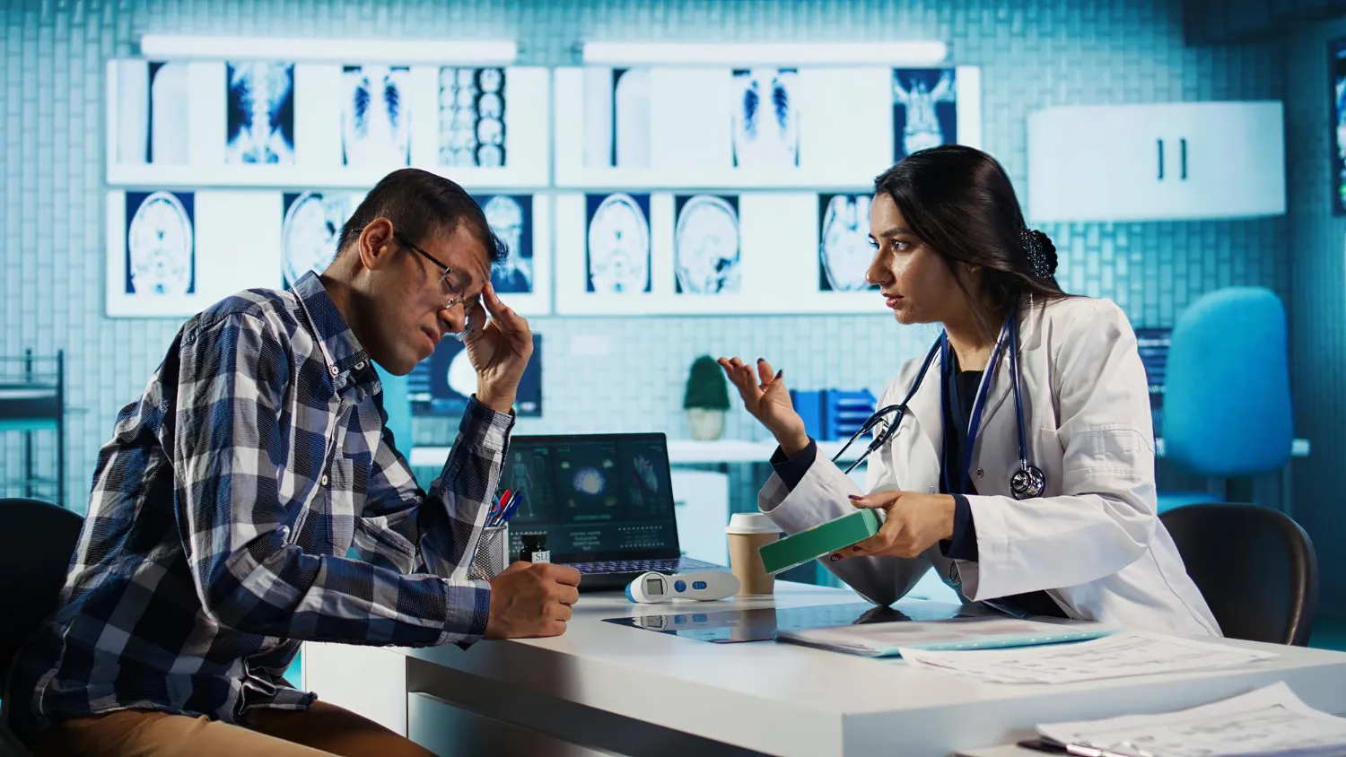 Physician discussing prescription approval requirements with a patient during a consultation, helping prescribers complete prior authorization for medication to avoid treatment delays.