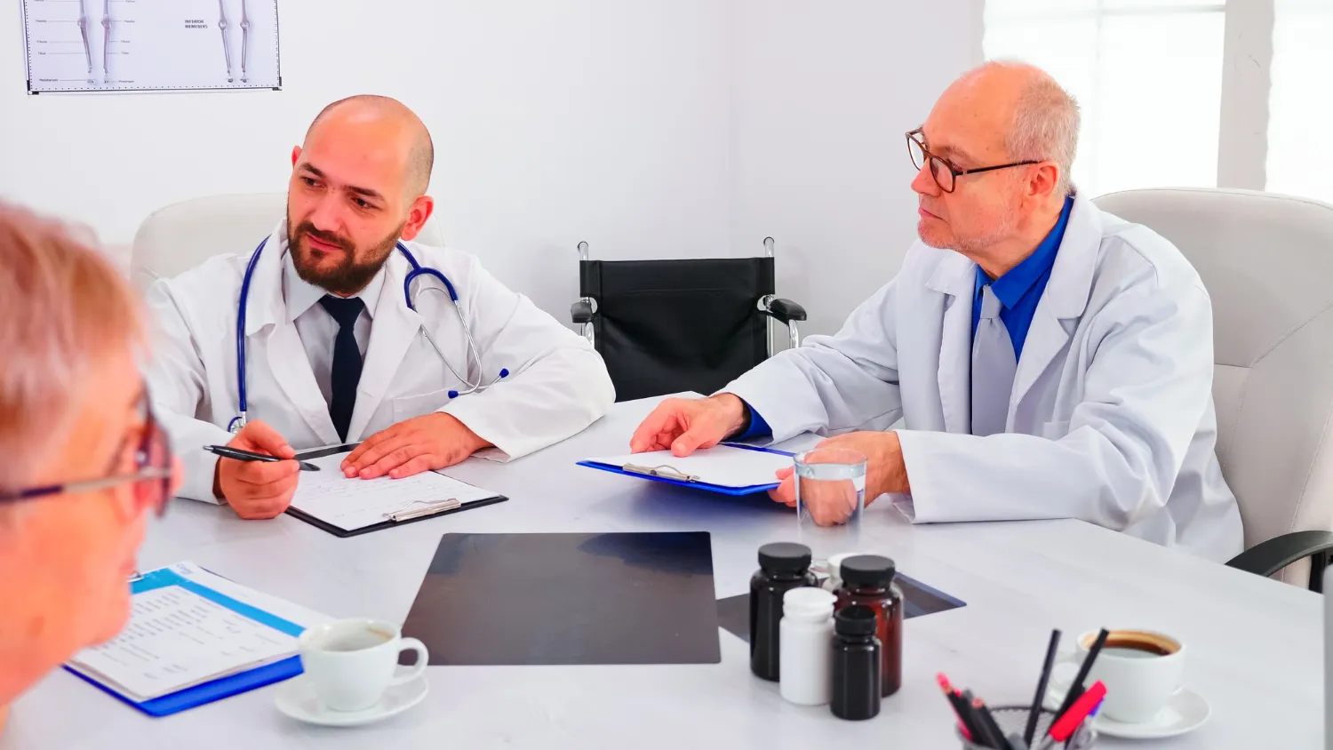 Healthcare professionals discussing patient documentation for prior authorization services.