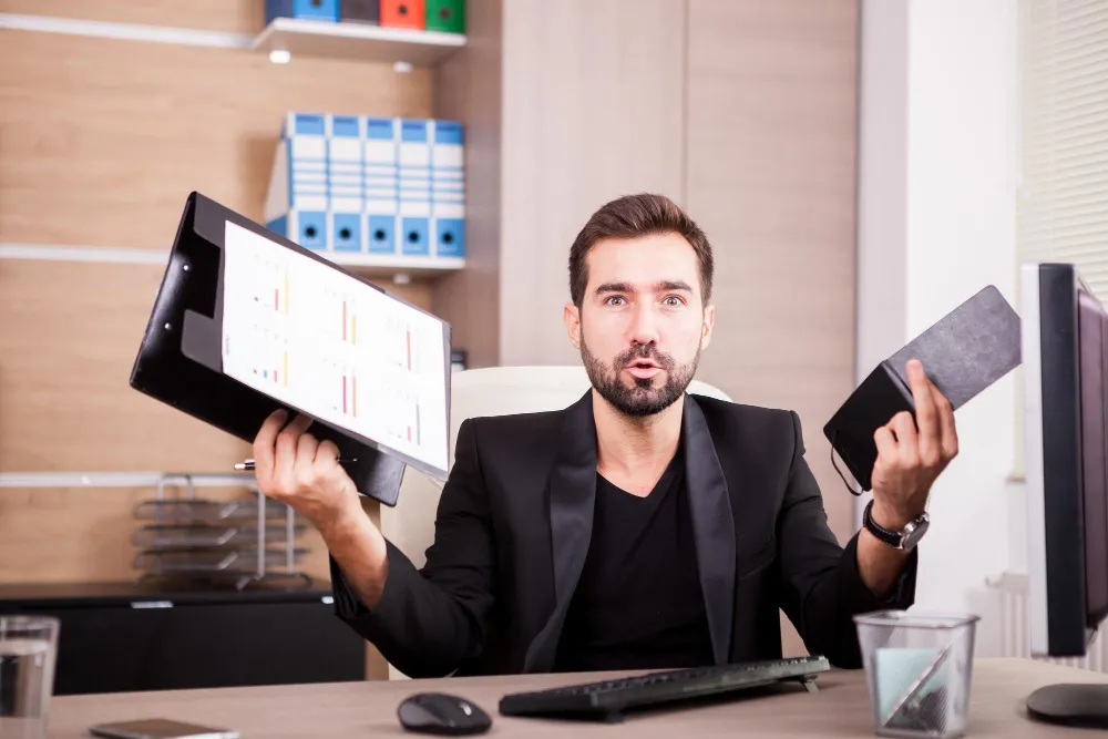 Business professional reviewing documents and charts related to Prior Authorization Services and Prior Authorization Solution.