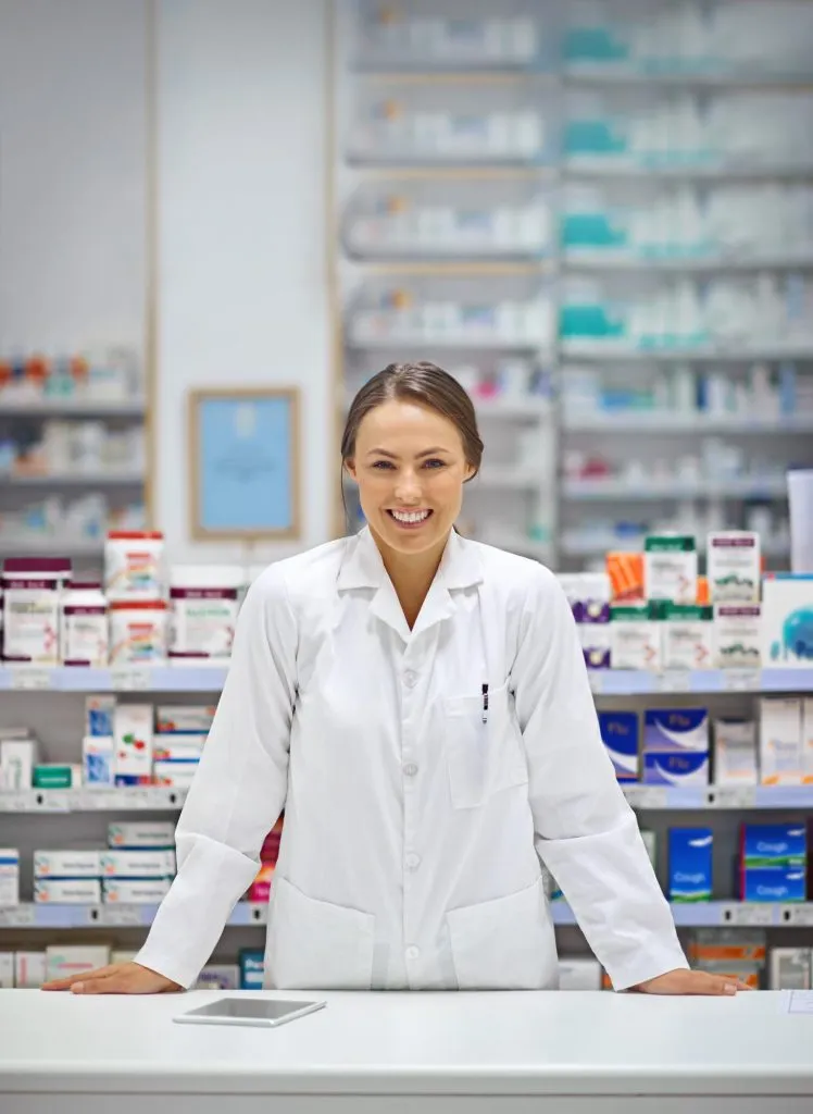 Pharmacy illustration showing pharmacist interacting with digital system, prescription processing, medication dispensing, and integration with electronic prior authorization and healthcare workflow solutions