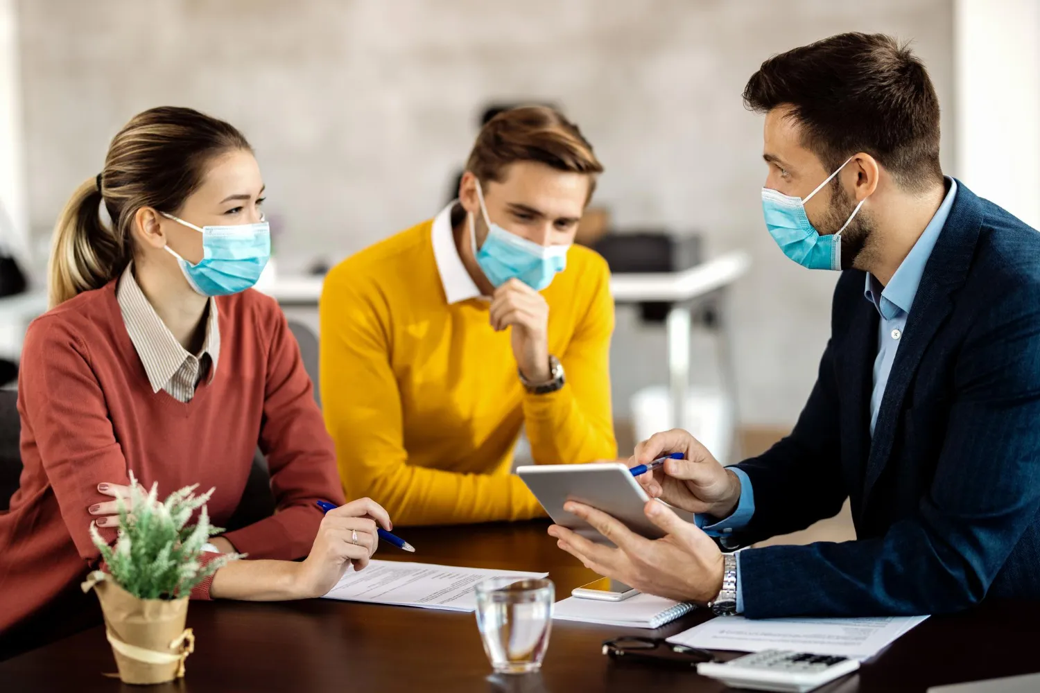 A healthcare professional discussing treatment and documentation with patients, representing efficient prior authorization solution workflows and streamlined prescription authorization solutions