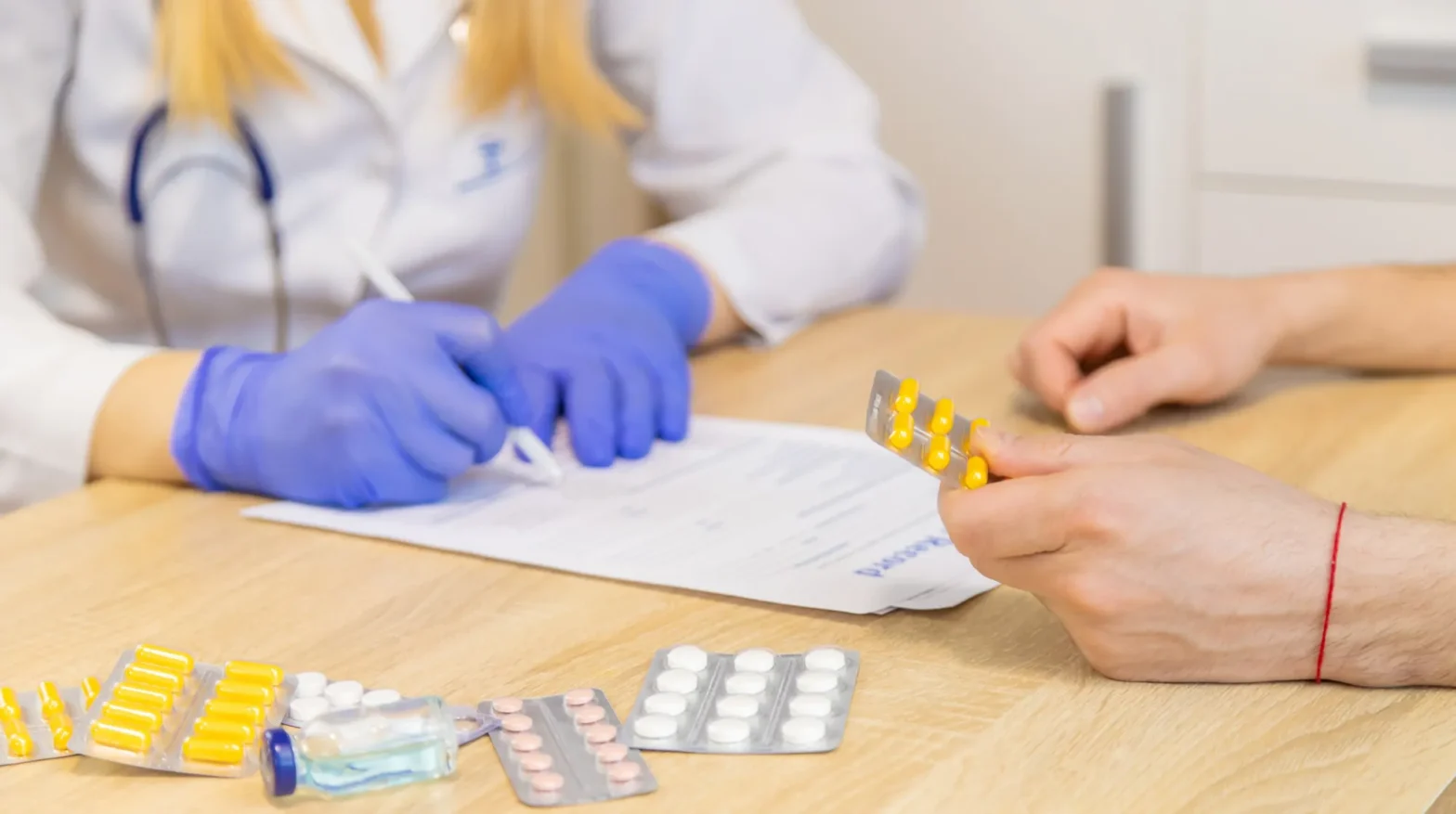 Doctor discussing prescriptions with patient as part of prescription authorization solutions to streamline prior authorization process