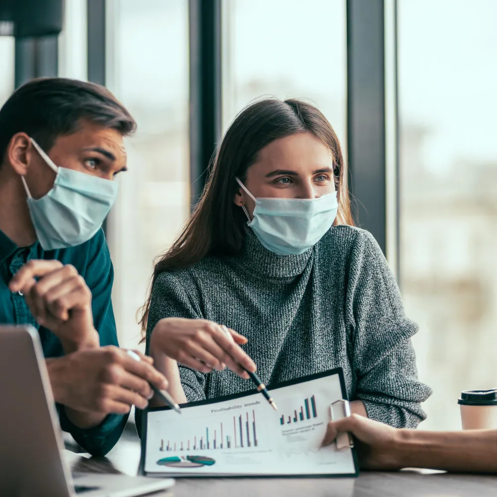 Healthcare professionals analyzing data and managing prior authorization services to improve approval efficiency