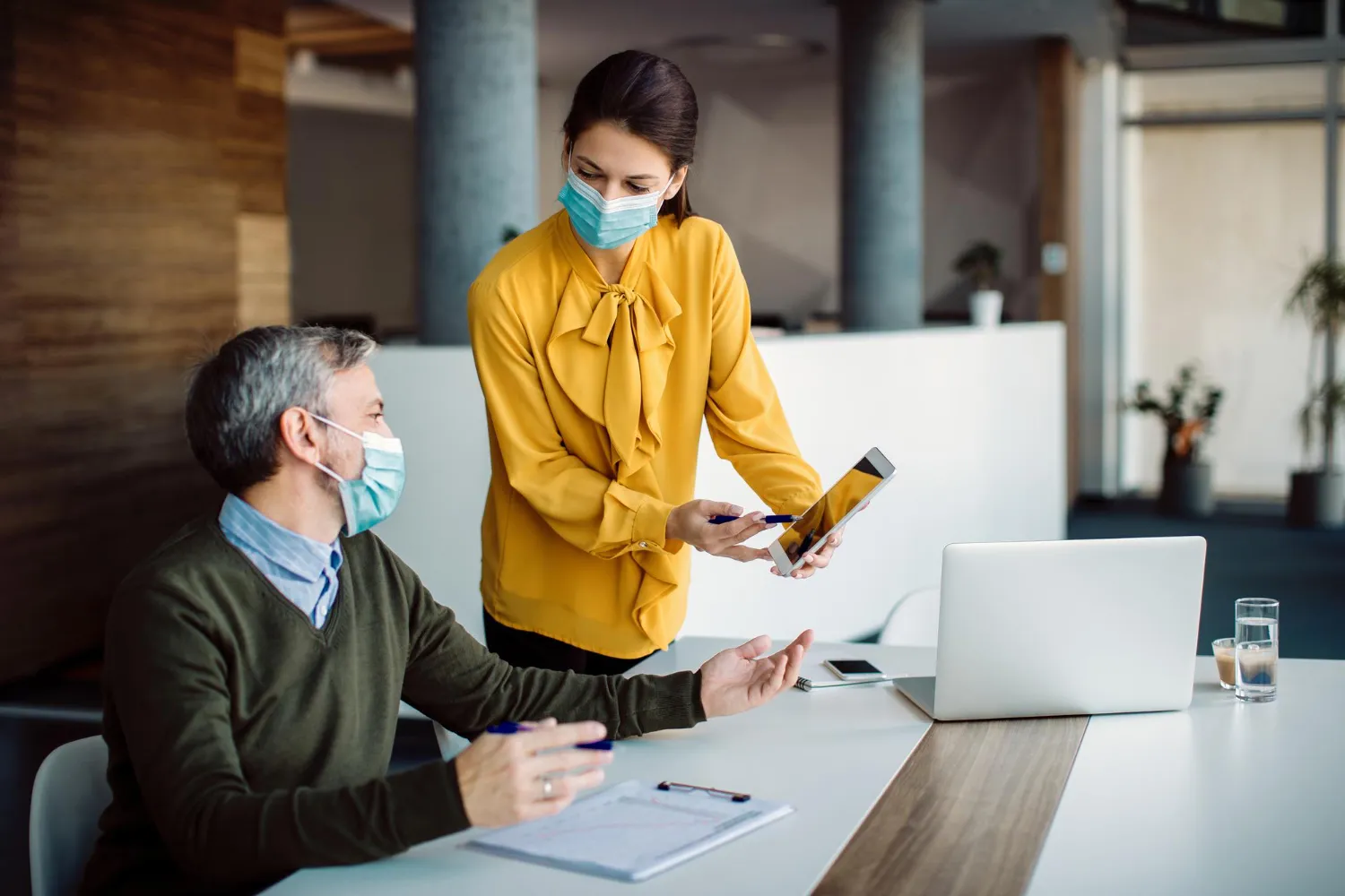 Healthcare staff reviewing digital medication requests on a tablet, highlighting Prescribers Medication Authorization Solutions that improve communication and speed up prior authorization approvals.