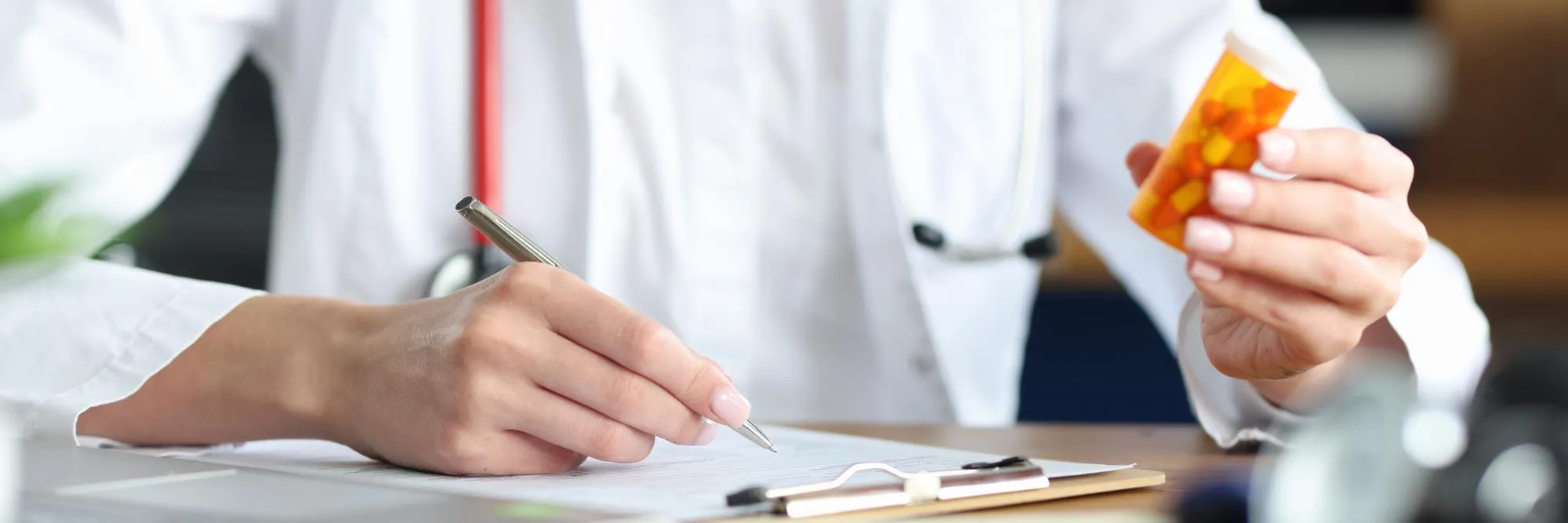 Healthcare professional reviewing medication and completing a prior authorization request, using an ePA platform to accelerate approvals and improve prescribing efficiency.