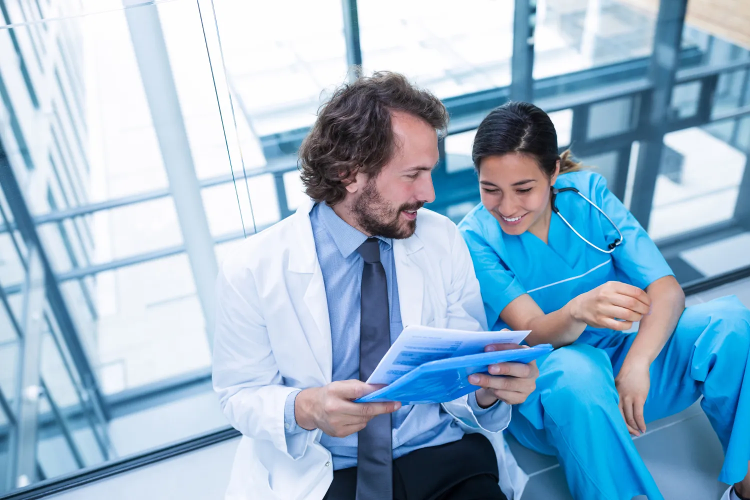 Medical professionals reviewing patient records with PA Rx solutions to improve ePA pharmacy and Rx ePA authorization processes.