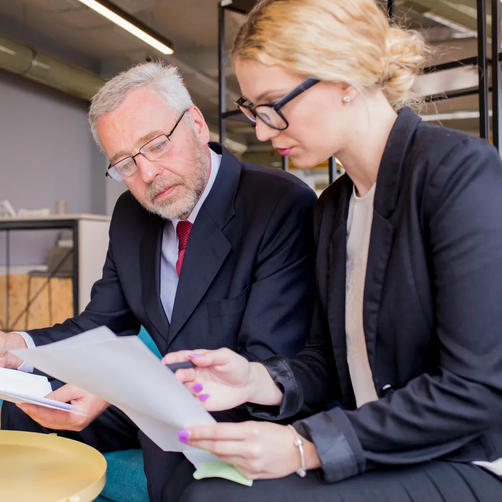 Healthcare professionals reviewing insurance and patient documents, highlighting a prior authorization provider that manages approvals for faster access to prescribed medications.